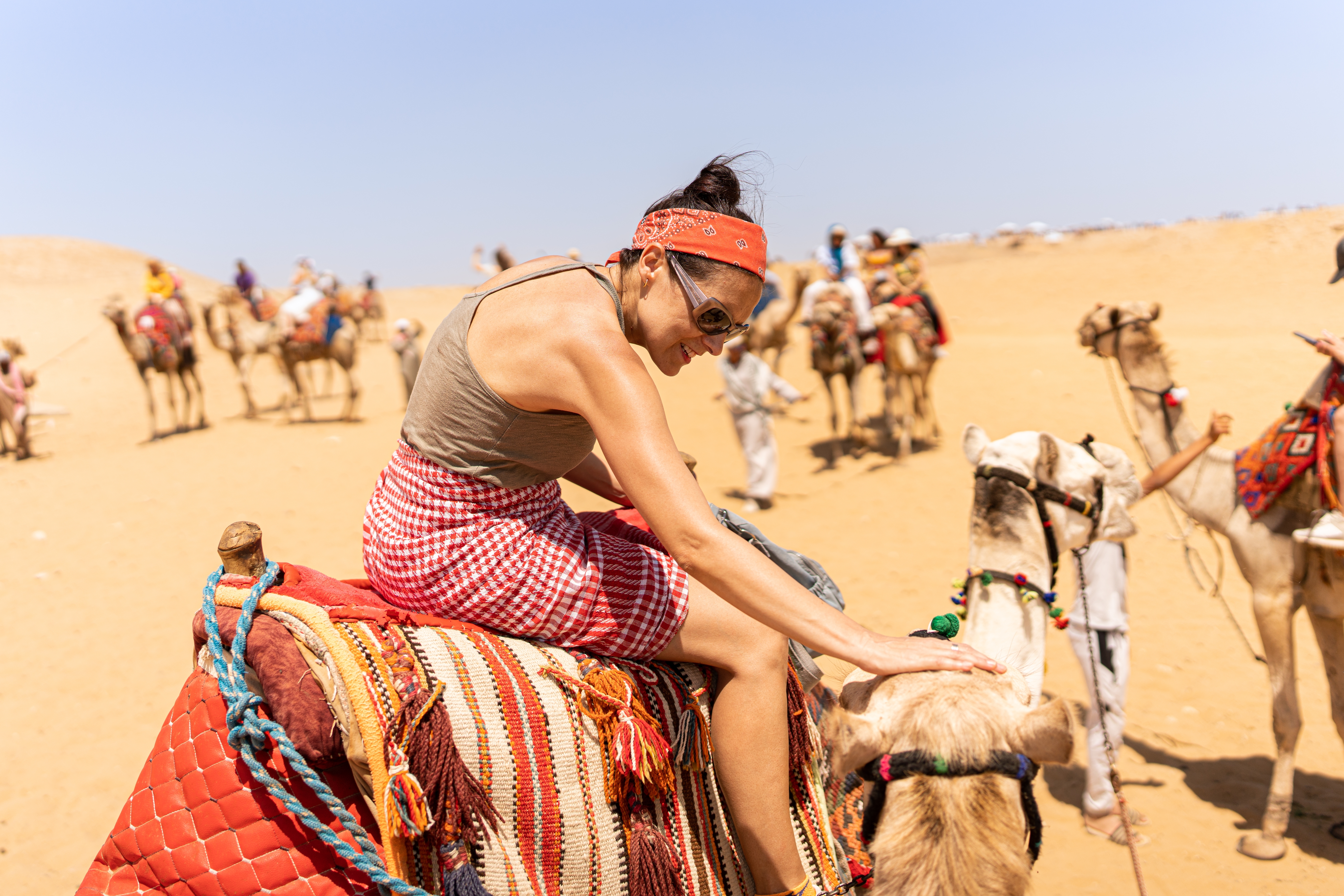 Tourist on top of a camel on a desert tour.Cairo, Egypt.